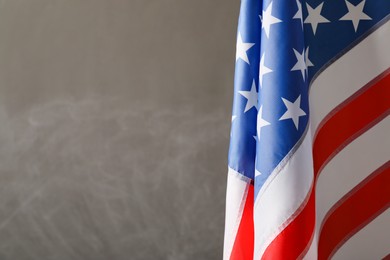 Photo of America flag on grey background, closeup with space for text. Memorial Day