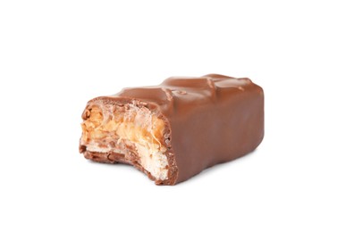 Photo of Piece of chocolate bar with caramel, nuts and nougat isolated on white