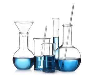 Photo of Set of laboratory glassware with blue liquid isolated on white