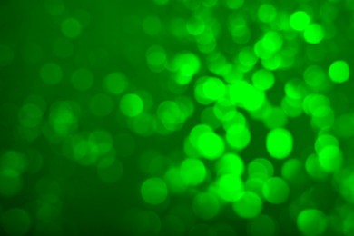 Image of St. Patrick day. Green background with blurred lights, bokeh effect