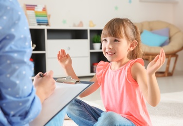 Photo of Cute little girl at child psychologist's office