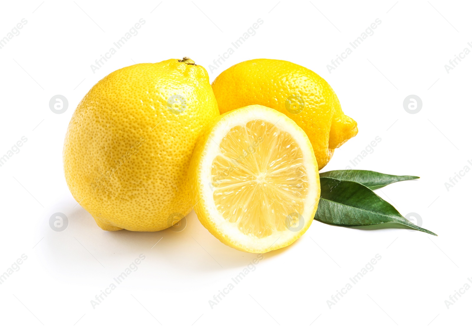 Photo of Ripe whole and sliced lemons on white background