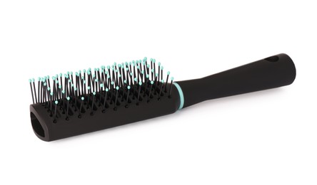 Photo of One new plastic hairbrush isolated on white