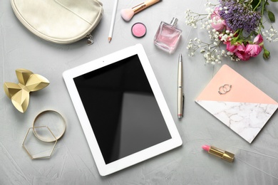 Photo of Flat lay composition with tablet and stylish accessories on light background. Blogger concept