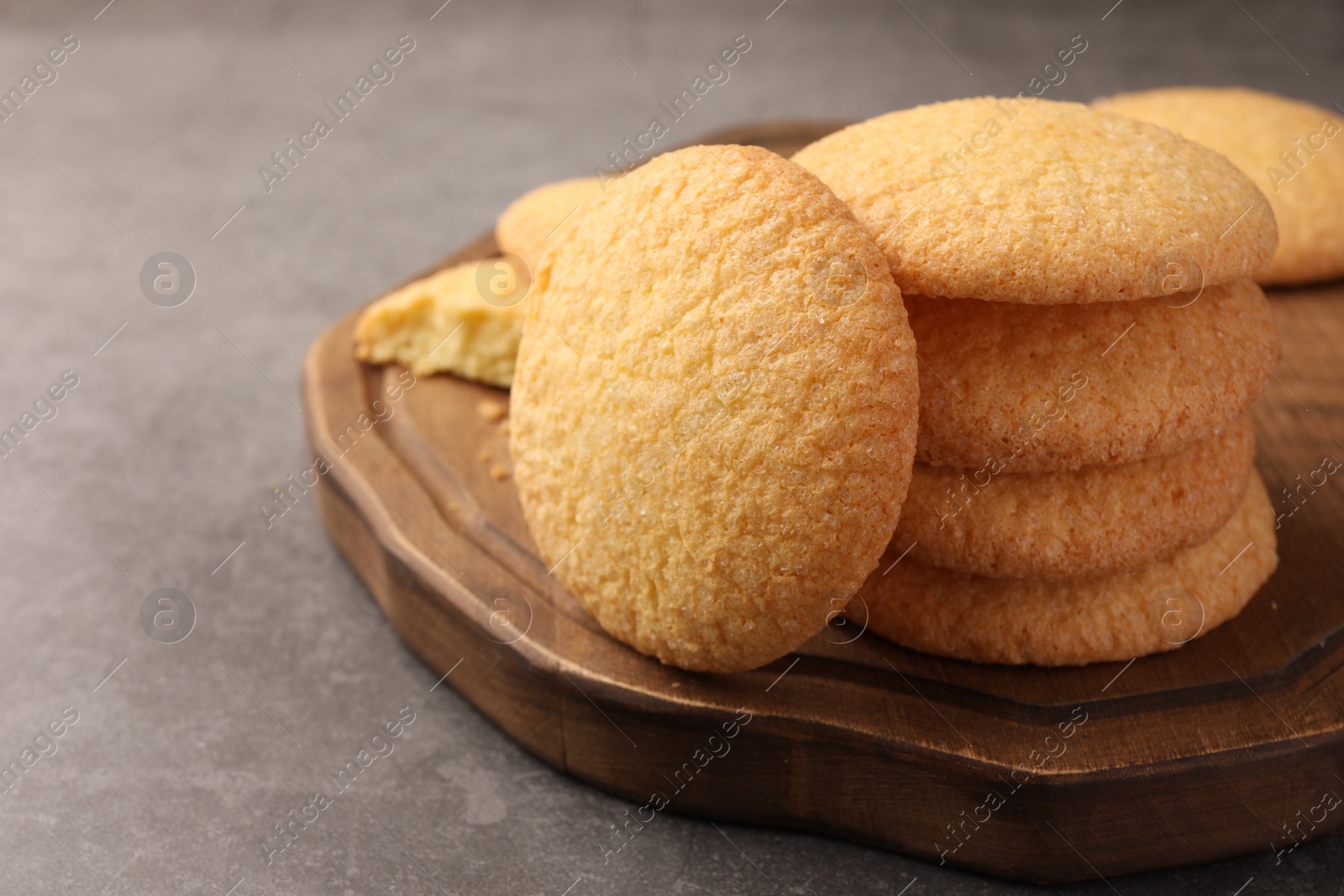 Photo of Delicious Danish butter cookies on grey table, closeup