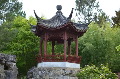 Photo of HAREN, NETHERLANDS - MAY 23, 2022: Beautiful view of oriental gazebo in Chinese garden