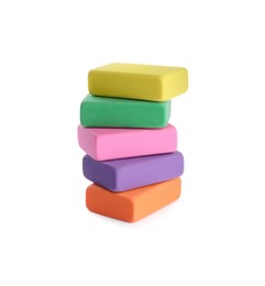 Photo of Stack of bright erasers on white background