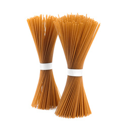 Photo of Uncooked buckwheat noodles isolated on white. Japanese cuisine