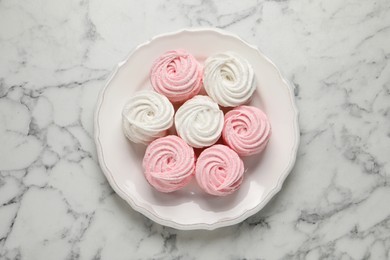 Photo of Delicious marshmallows on white marble table, top view
