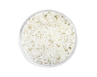 Photo of Natural herb salt in glass bowl isolated on white, top view