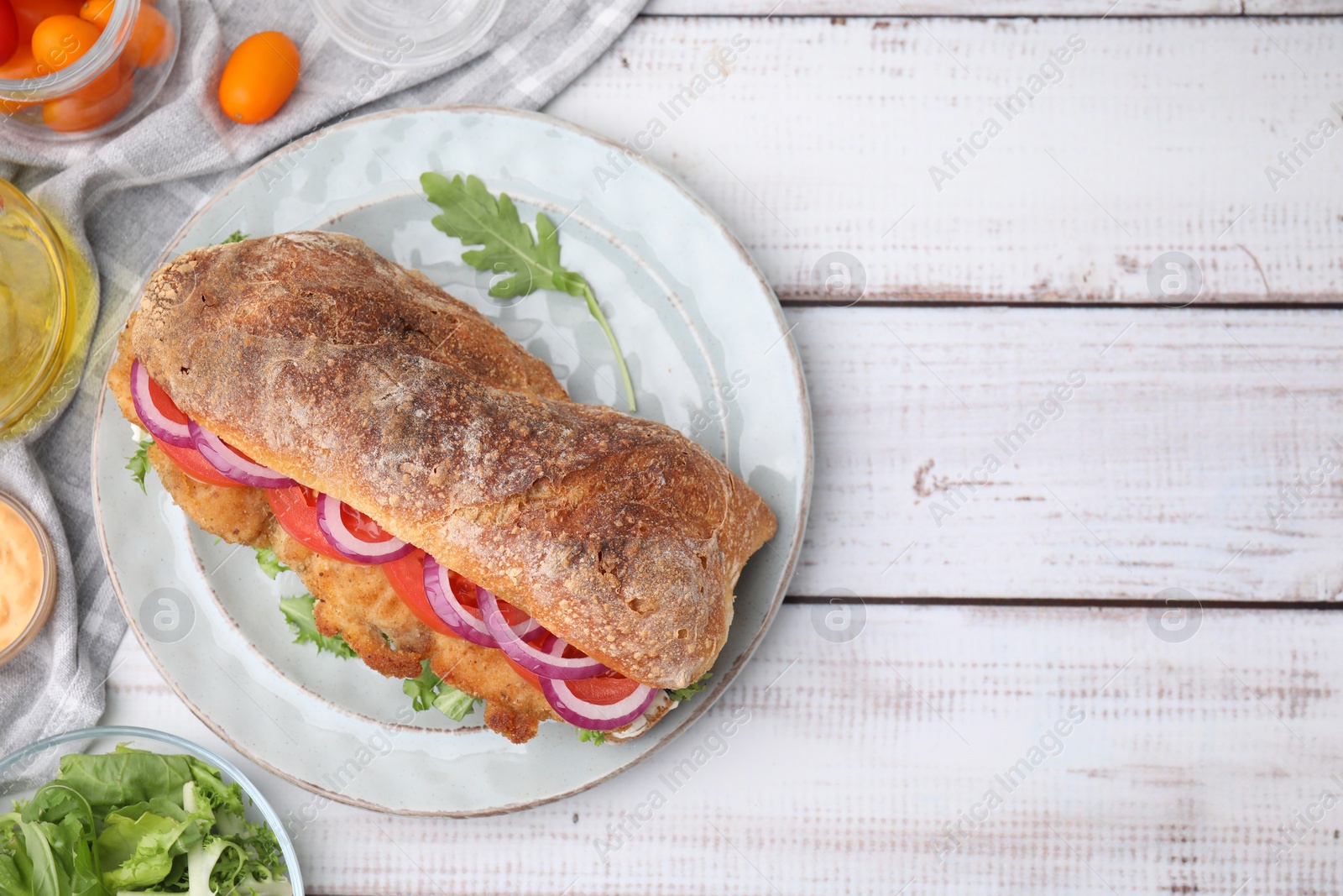 Photo of Delicious sandwich with schnitzel on white wooden table, flat lay. Space for text