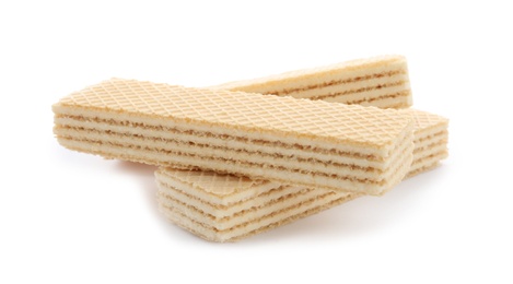 Photo of Delicious vanilla wafer sticks isolated on white