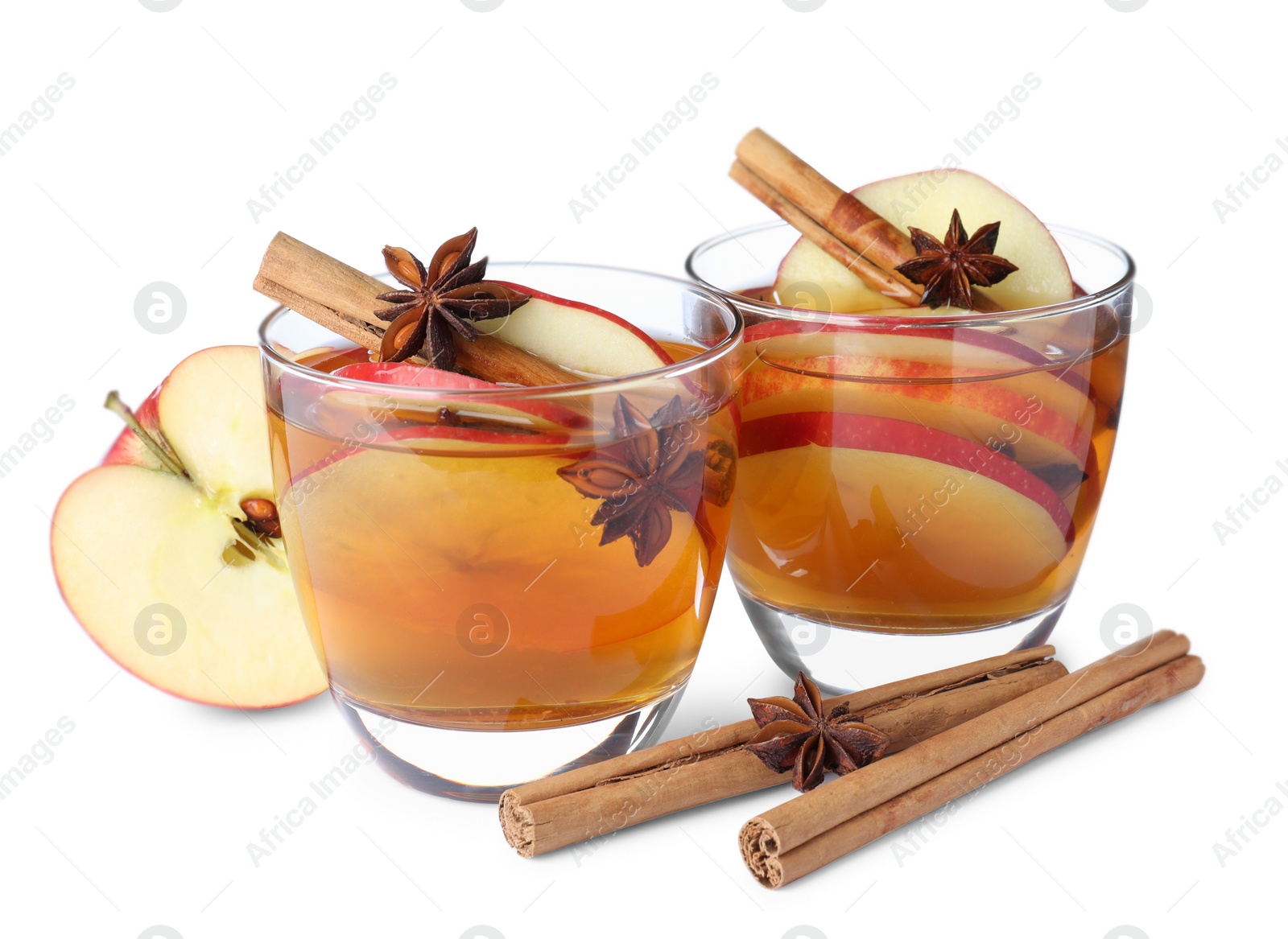 Photo of Hot mulled cider and ingredients on white background