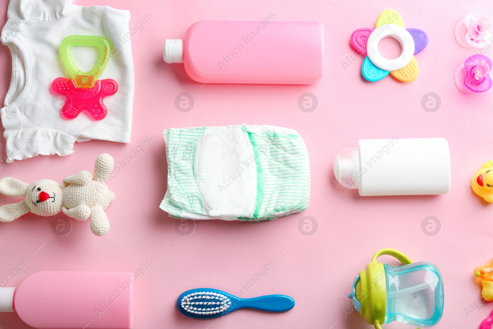 Photo of Flat lay composition with baby accessories on color background