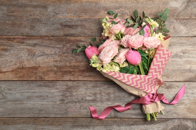 Bouquet of beautiful fragrant flowers on wooden background