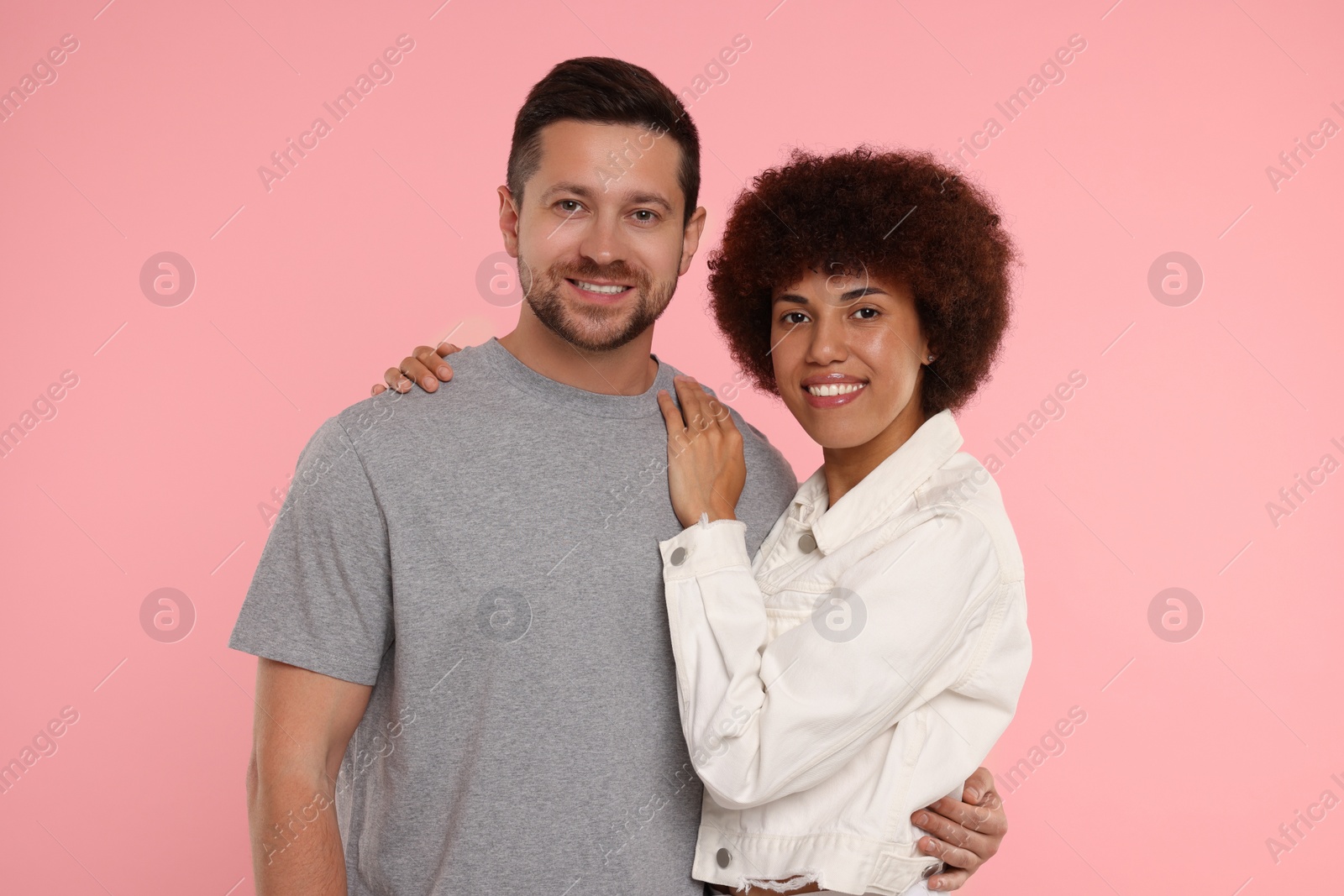 Photo of International dating. Portrait of lovely couple on pink background