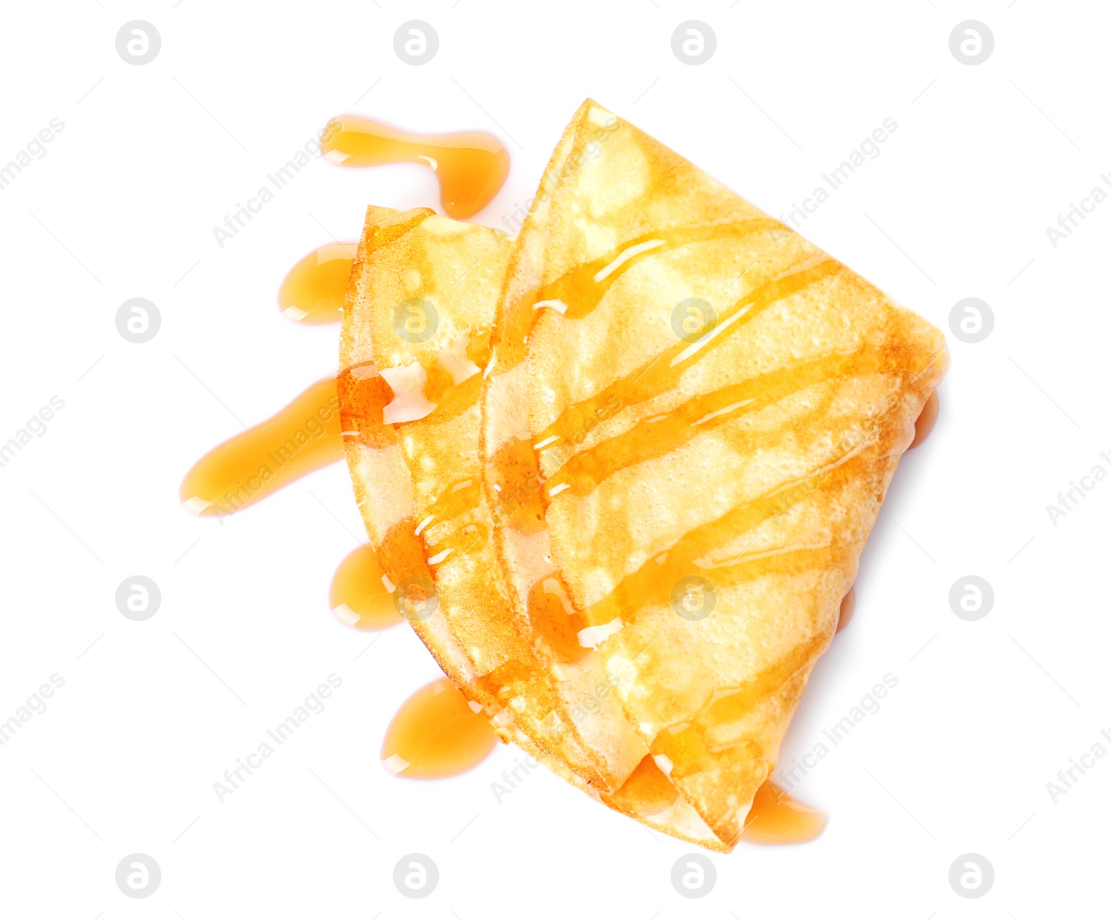 Photo of Tasty thin pancake with maple syrup on white background, top view