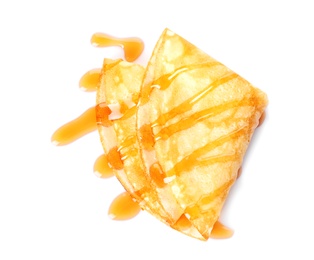 Photo of Tasty thin pancake with maple syrup on white background, top view