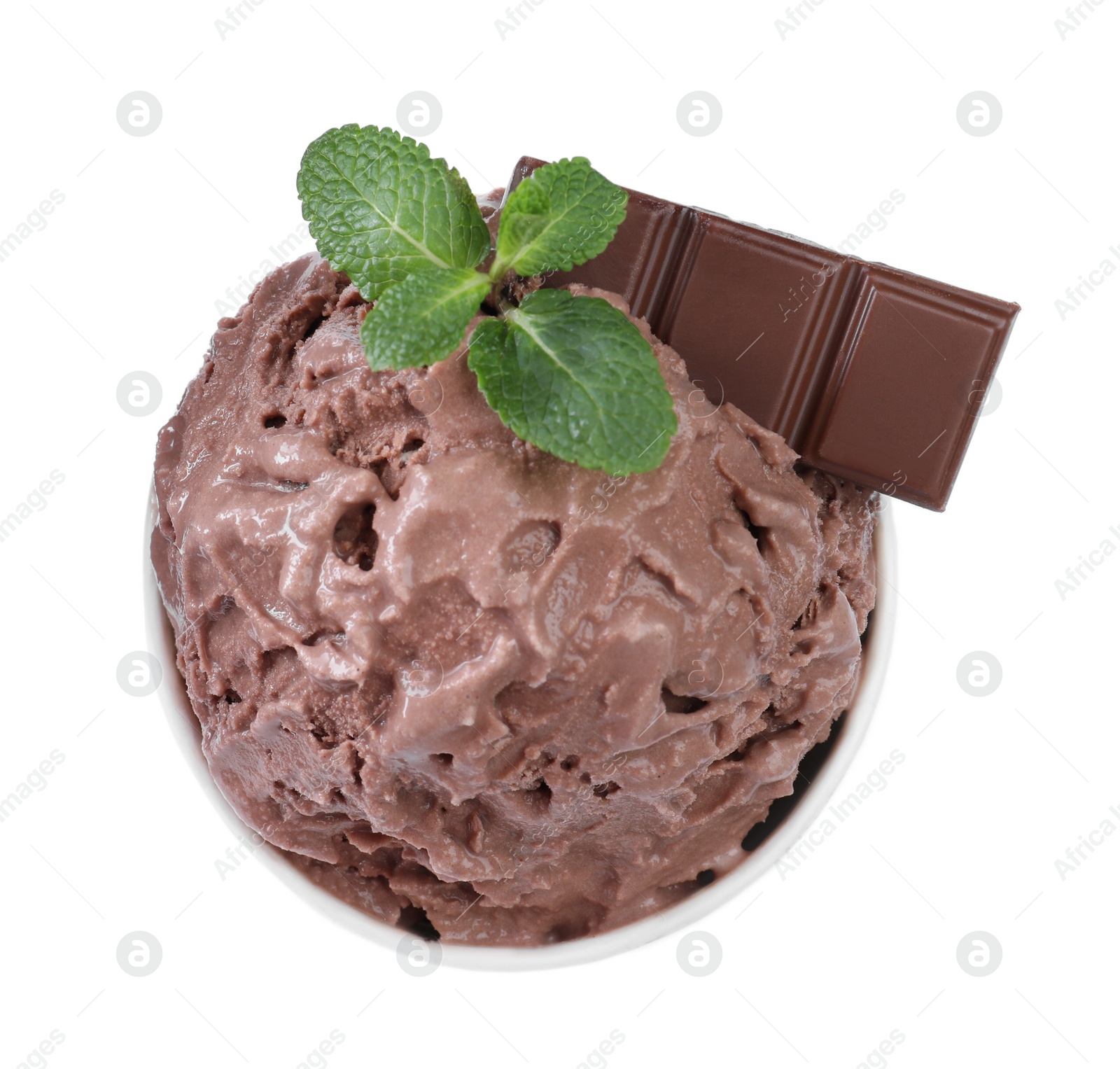 Photo of Delicious chocolate ice cream with mint in paper cup isolated on white, top view