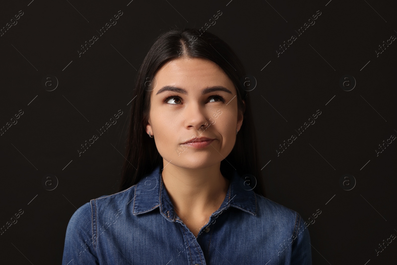 Photo of Personality concept. Emotional woman on black background