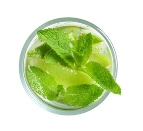 Refreshing beverage with mint and lime in glass on white background, top view