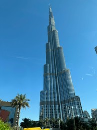 Dubai, United Arab Emirates - May 2, 2023: Beautiful view of Burj Khalifa in city under blue sky