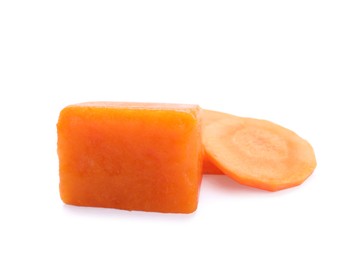Photo of Frozen carrot puree cube and fresh carrot isolated on white