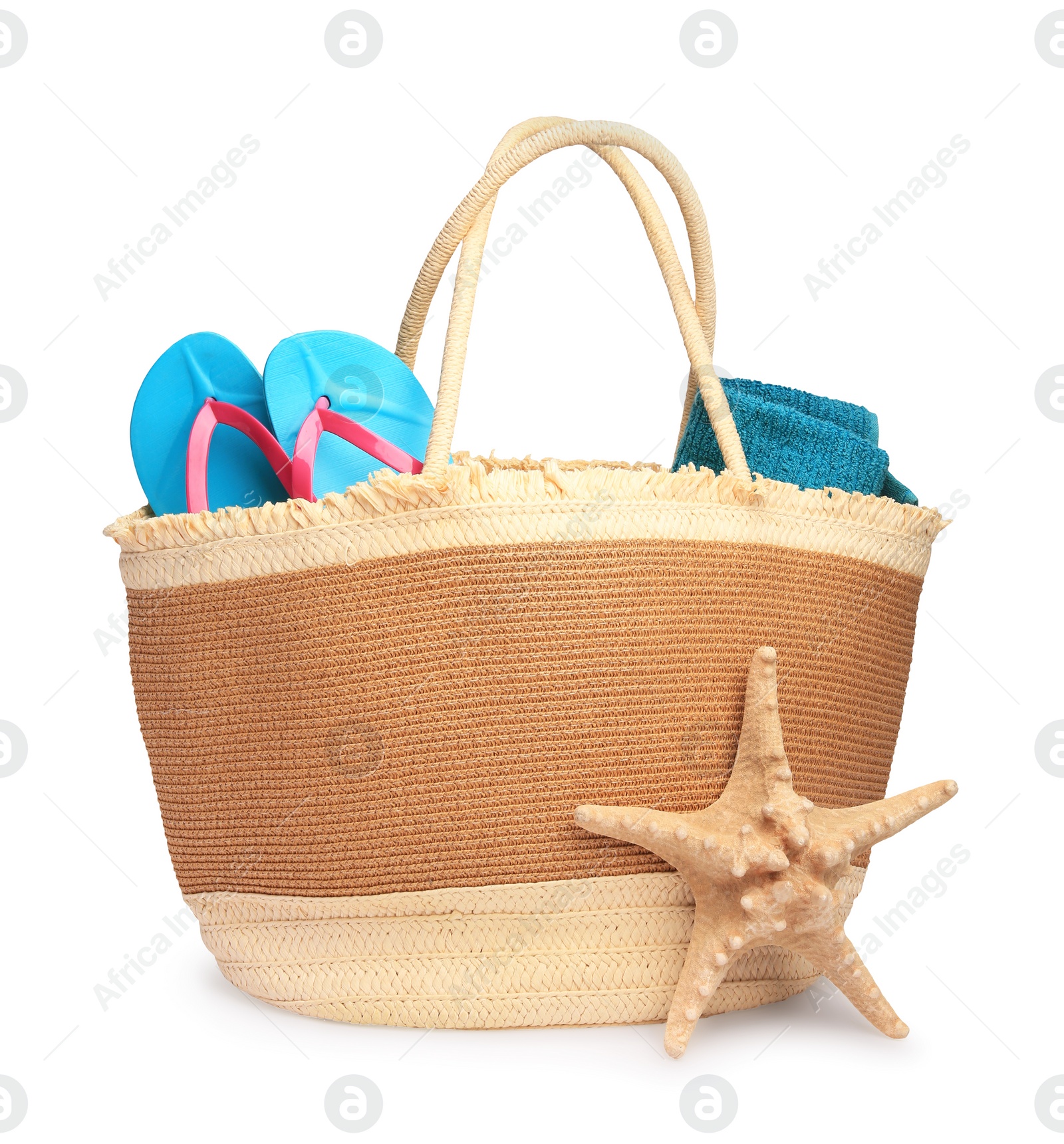 Photo of Stylish straw bag with beach objects and starfish isolated on white