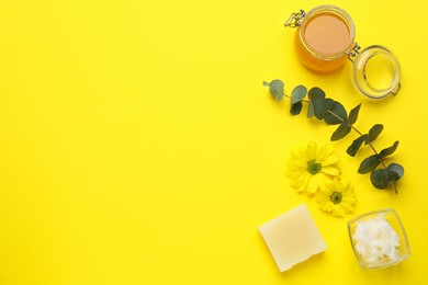 Photo of Flat lay composition with beeswax cosmetics on yellow background. Space for text
