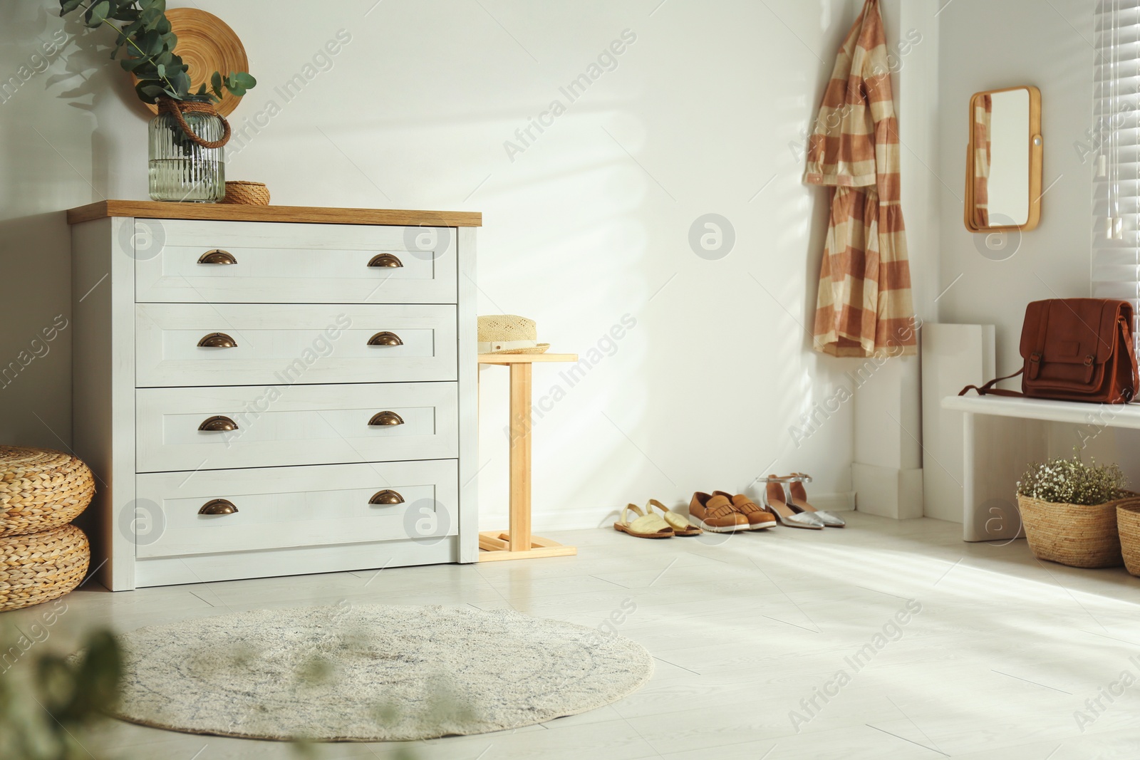 Photo of Chest of drawers in stylish room interior