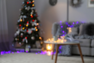 Blurred view of living room with beautiful Christmas tree