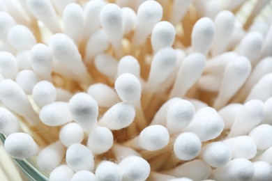 Photo of Many cotton buds in glass jar, closeup