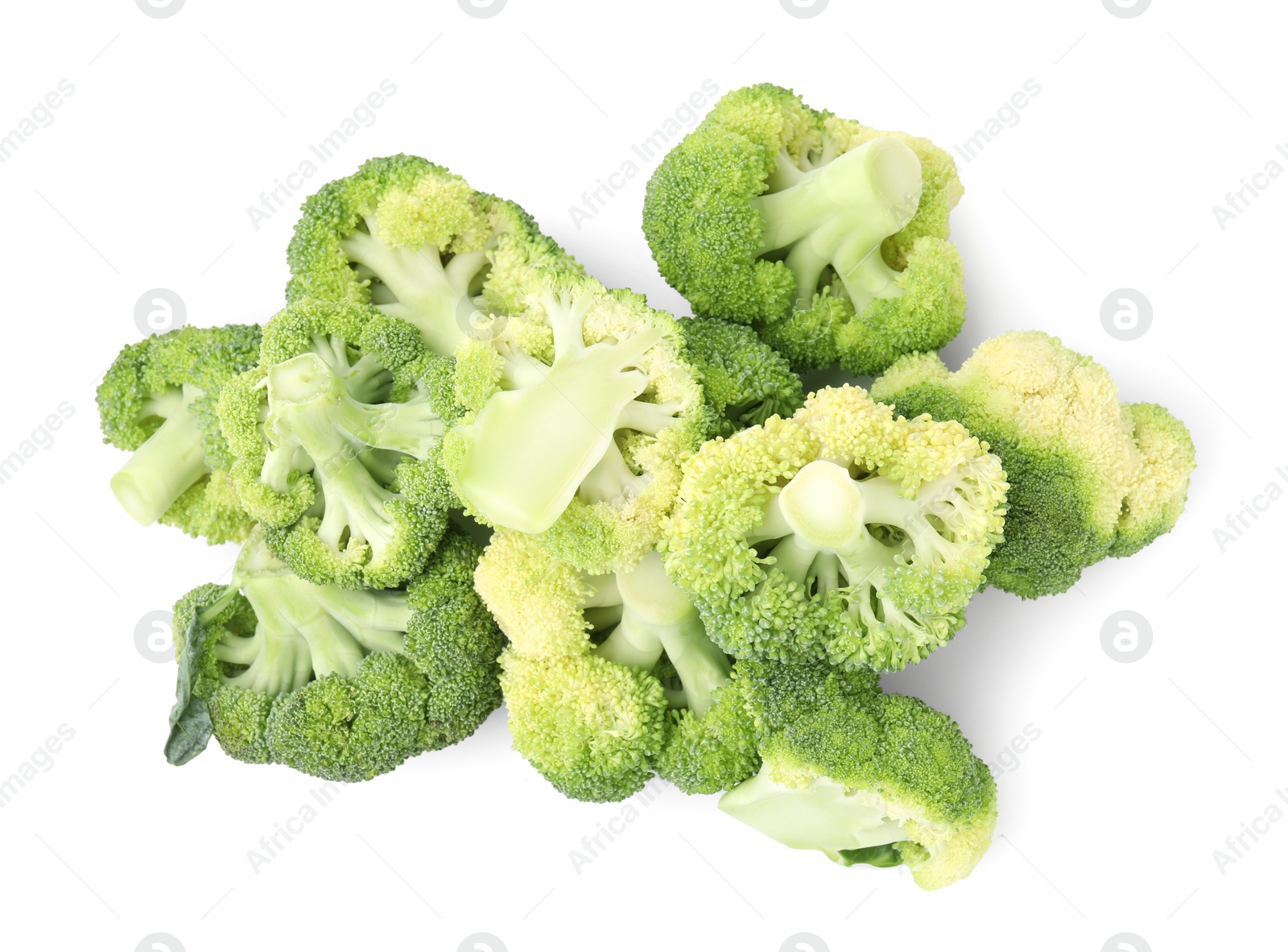 Photo of Pile of fresh raw green broccoli isolated on white, top view