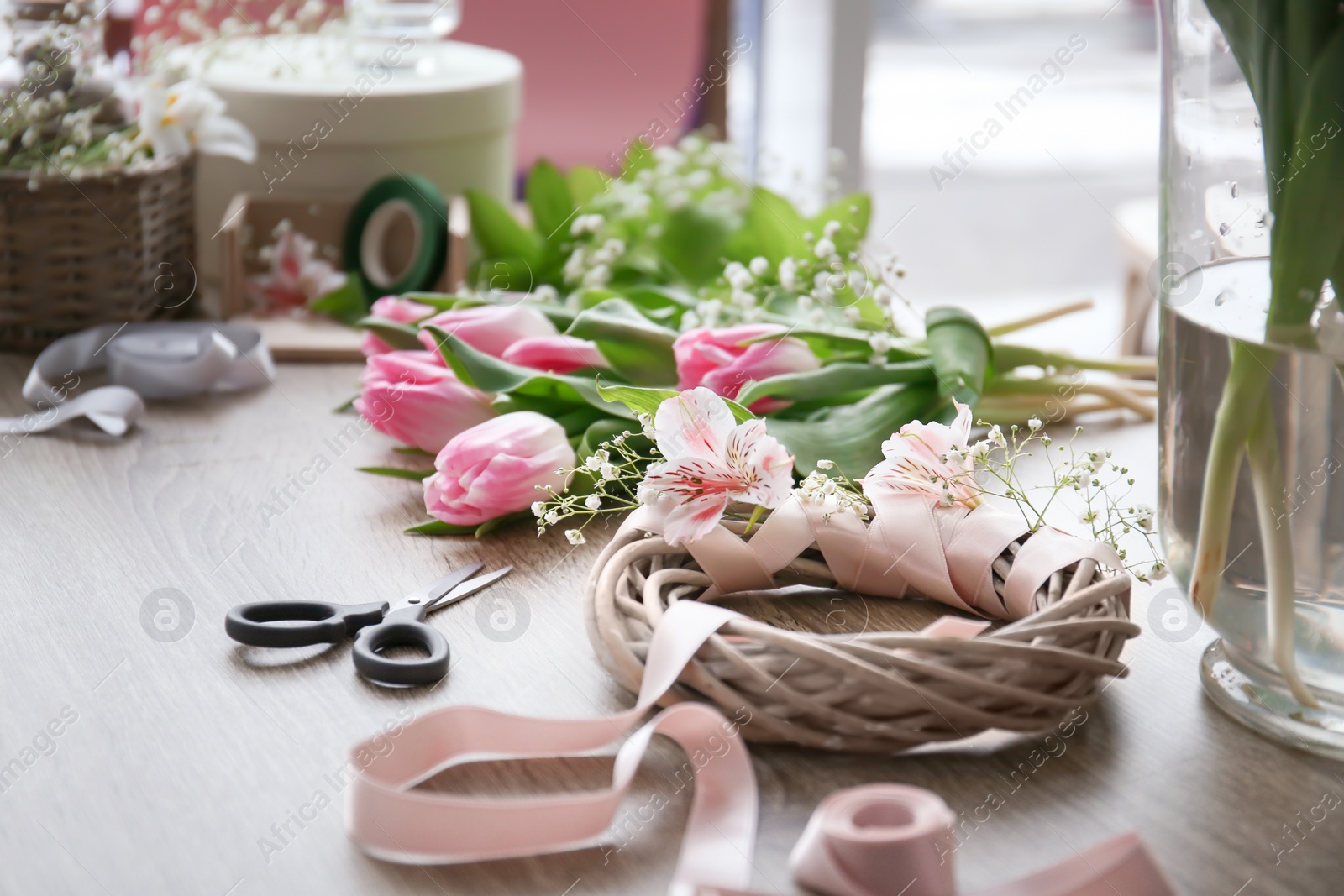 Photo of Decorator's workplace with beautiful flowers