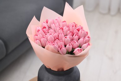 Photo of Bouquet of beautiful pink tulips in vase indoors