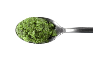 Photo of Spoon of tasty pesto sauce isolated on white, top view