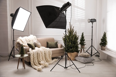 Beautiful Christmas themed photo zone. Cozy living room interior imitation
