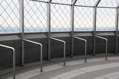 Enclosed observation deck equipped with metal handrails