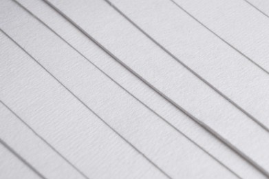 Photo of Many sheets of watercolor paper as background, closeup