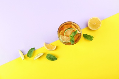 Photo of Flat lay composition with refreshing iced tea on color background