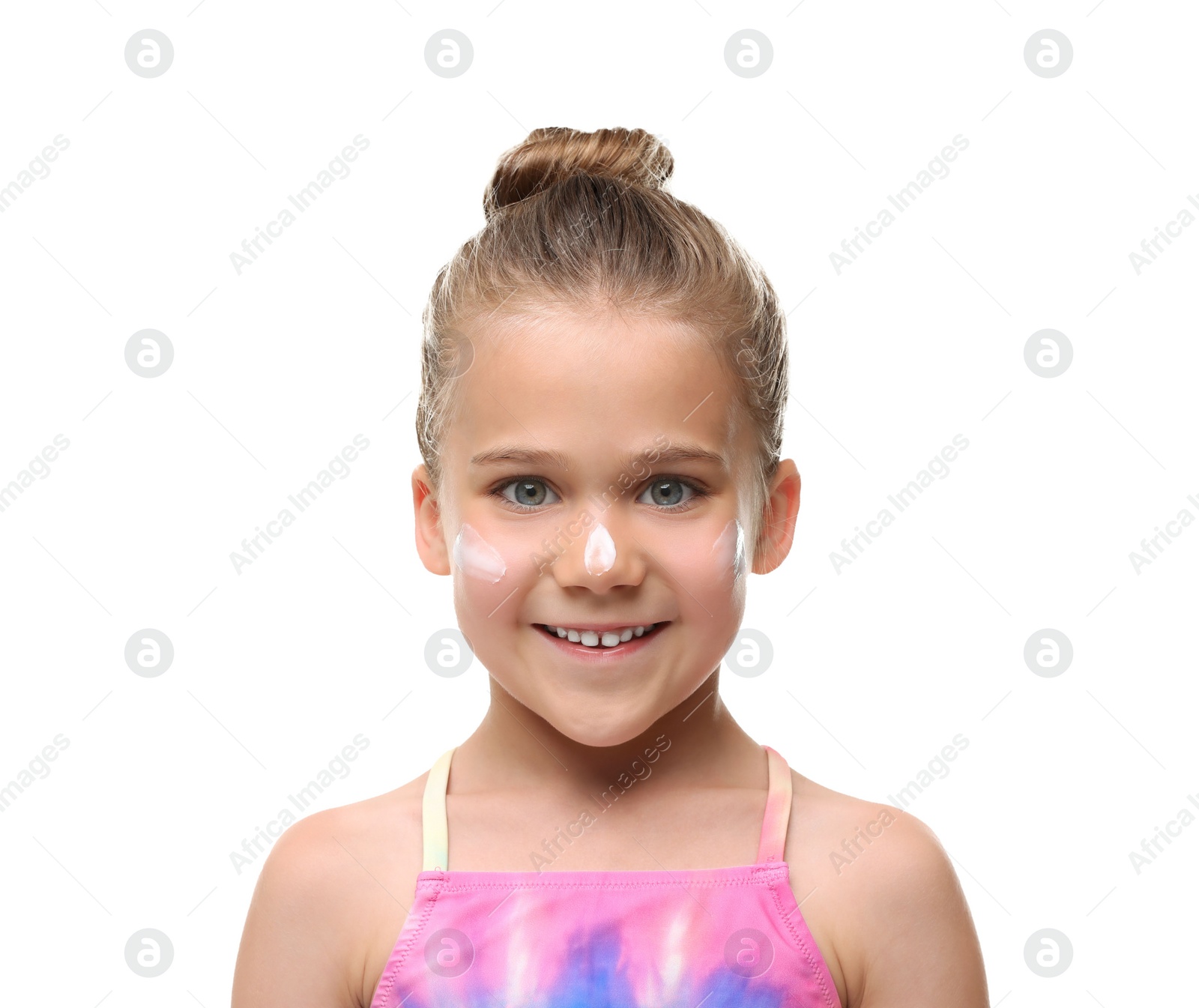 Photo of Happy girl with sun protection cream on her face against white background