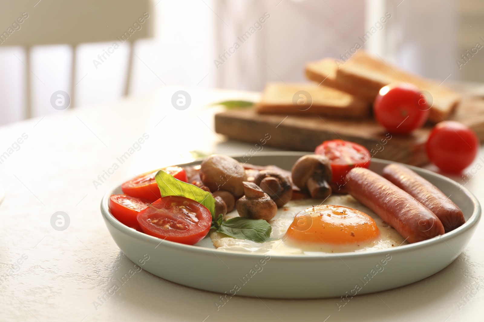 Photo of Tasty breakfast with fried egg on light table