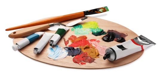 Photo of Wooden palette with oil paints and tools on white background