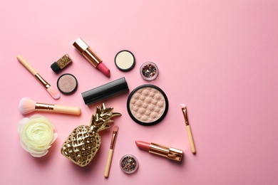 Photo of Flat lay composition with decorative cosmetics on color background