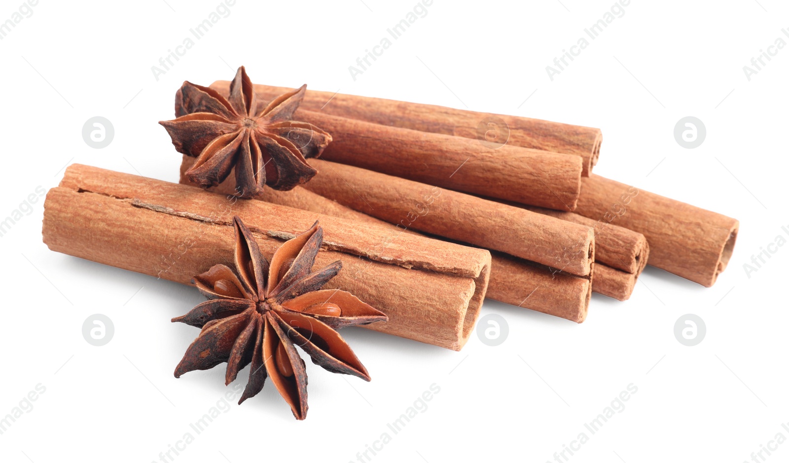 Photo of Aromatic cinnamon sticks and anise stars isolated on white