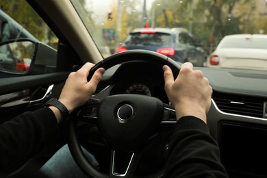 Photo of Man driving his car, closeup. Traffic rules