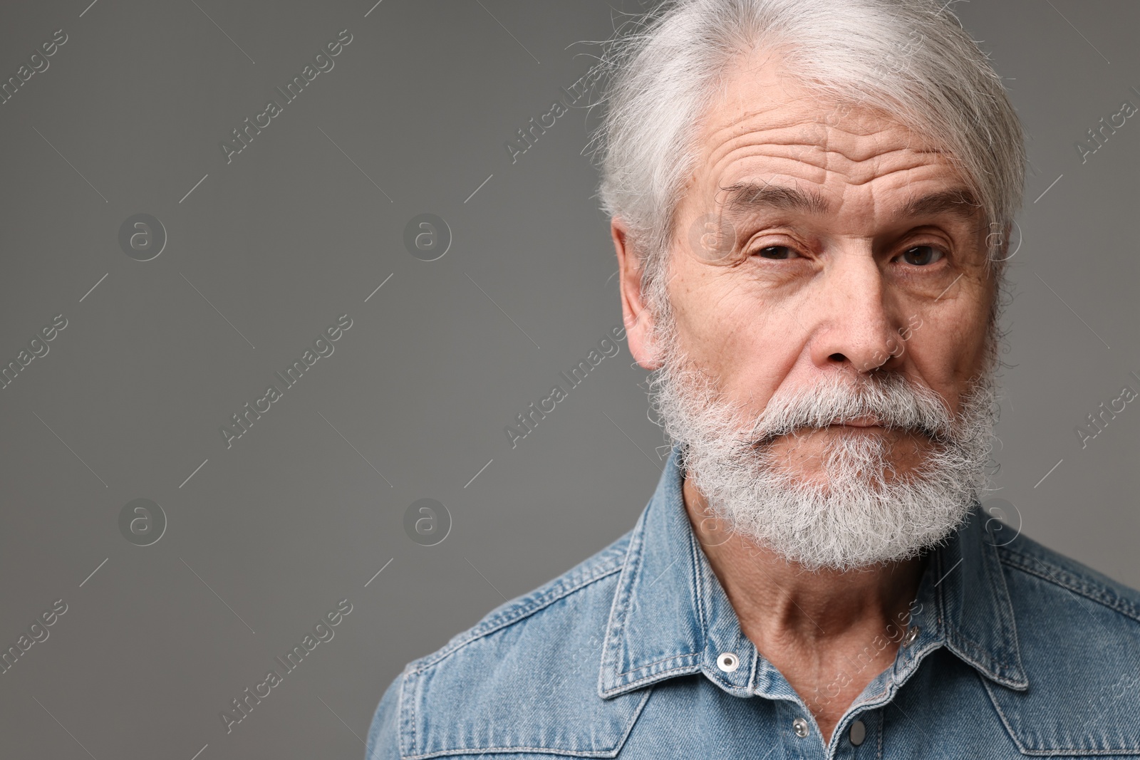 Photo of Senior man with mustache on grey background, space for text