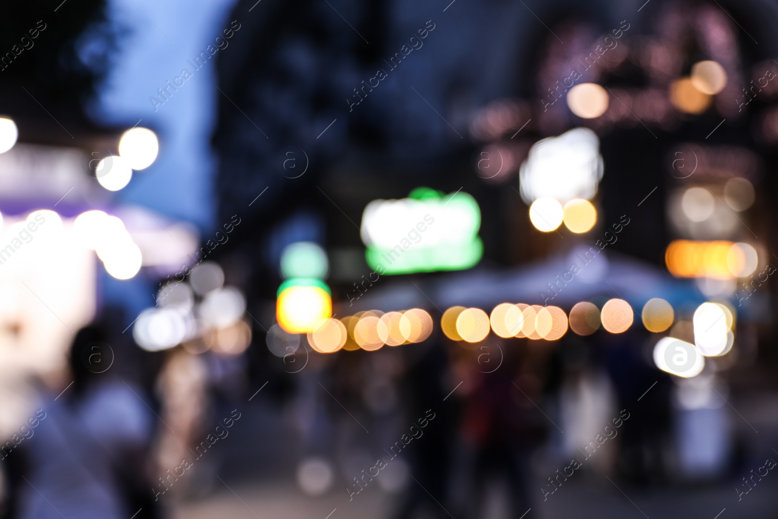 Photo of Blurred view of modern city at evening. Bokeh effect