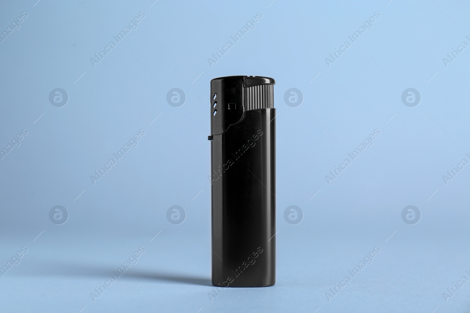 Photo of Stylish small pocket lighter on white background