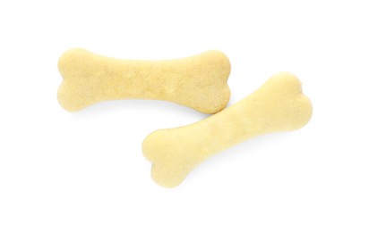 Photo of Bone shaped dog cookies on white background, top view